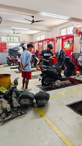 Technicians servicing scooter
